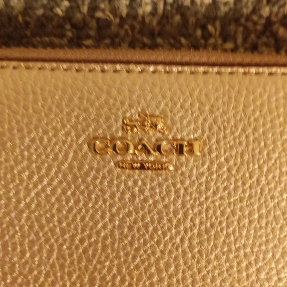 Coach gold pebbled leather accordion wallet